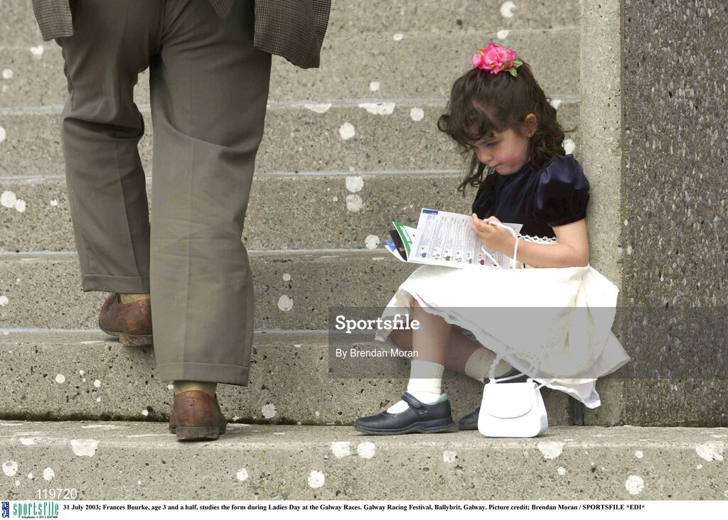 31 July 2003; Frances Bourke, age 3 and a half, studies the form during Ladies Day at the Galway Races. Galway Racing Festival, Ballybrit, Galway. Picture credit; Brendan Moran / SPORTSFILE *EDI*