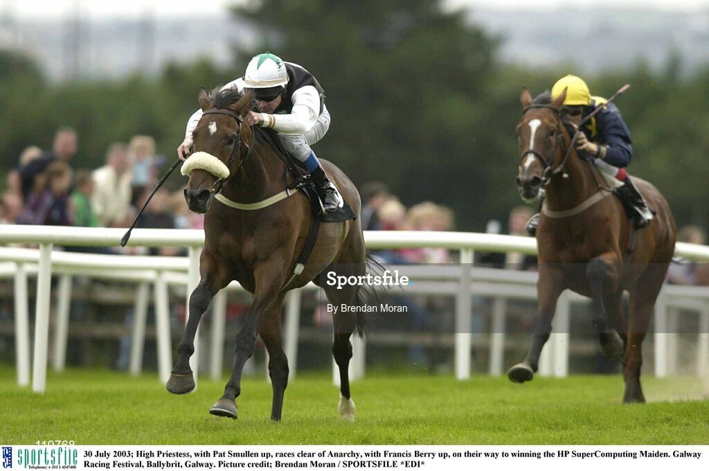 30 July 2003; High Priestess, with Pat Smullen up, races clear of Anarchy, with Francis Berry up, on their way to winning the HP SuperComputing Maiden. Galway Racing Festival, Ballybrit, Galway. Picture credit; Brendan Moran / SPORTSFILE *EDI*
