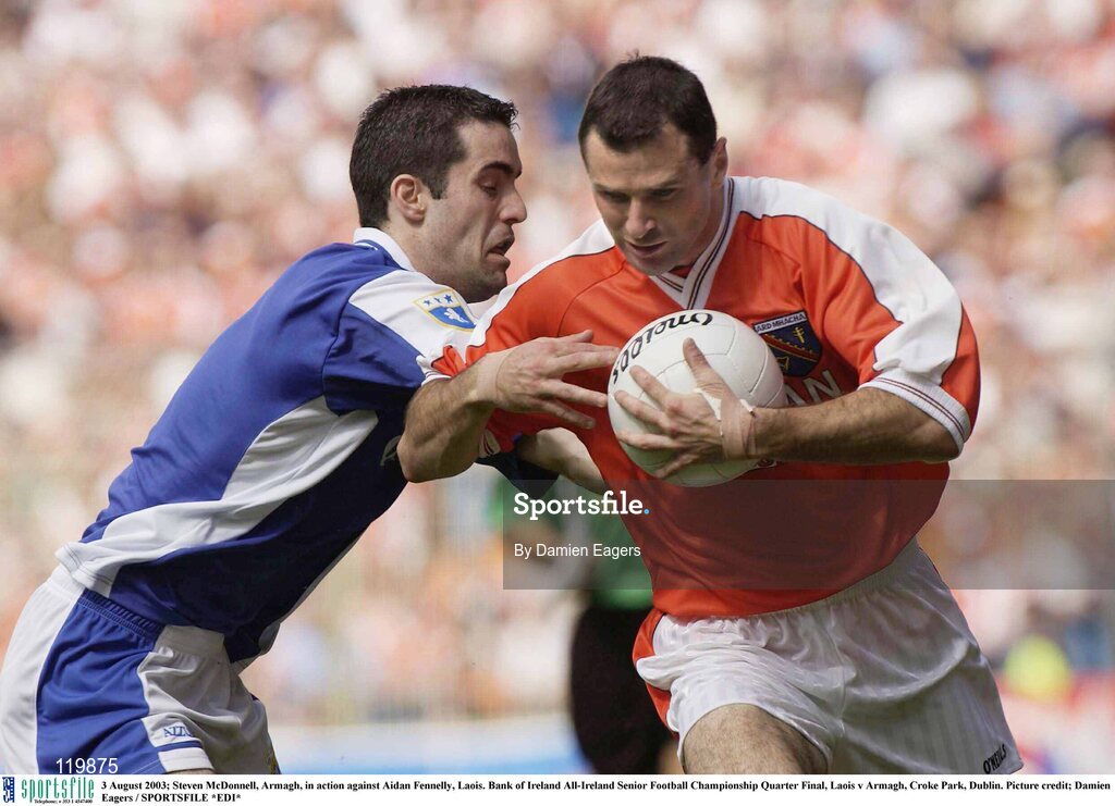 3 August 2003; Steven McDonnell of Armagh in action against Aidan Fennelly of Laois during the Bank of Ireland All-Ireland Senior Football Championship Quarter Final between Laois and Armagh at Croke Park in Dublin. Photo by Damien Eagers/Sportsfile