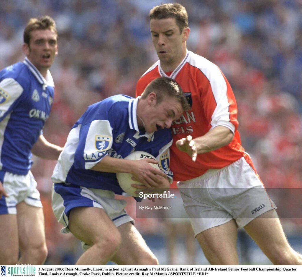 3 August 2003; Ross Munnelly of Laois, in action against Paul McGrane of Armagh during the Bank of Ireland All-Ireland Senior Football Championship Quarter Final between Laois and Armagh at Croke Park in Dublin. Photo by Ray McManus/Sportsfile