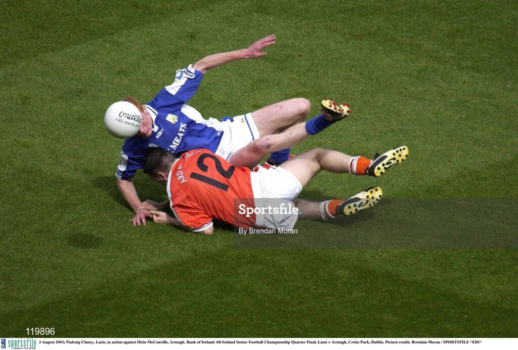 3 August 2003; Padraig Clancy of Laois in action against Oisin McConville of Armagh during the Bank of Ireland All-Ireland Senior Football Championship Quarter Final between Laois and Armagh at Croke Park in Dublin. Photo by Brendan Moran/Sportsfile