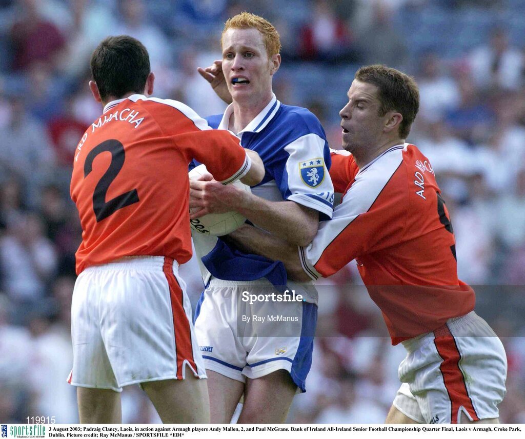 3 August 2003; Padraig Clancy of Laois in action against  Andy Mallon of Armagh, left, and Paul McGrane of Armagh during the Bank of Ireland All-Ireland Senior Football Championship Quarter Final between Laois and Armaghat Croke Park in Dublin. Photo by Ray McManus/Sportsfile