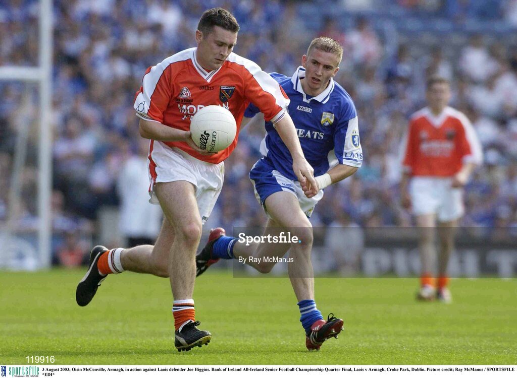 3 August 2003; Oisin McConville of Armagh in action against Joe Higgins of Laois during the Bank of Ireland All-Ireland Senior Football Championship Quarter Final between Laois and Armagh at Croke Park in Dublin. Photo by Ray McManus/Sportsfile