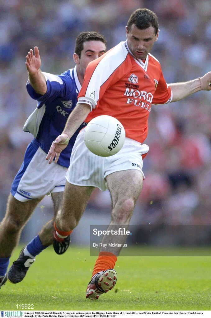 3 August 2003; Steven McDonnell of Armagh in action against Joe Higgins of Laois during the Bank of Ireland All-Ireland Senior Football Championship Quarter Final between Laois and Armagh at Croke Park in Dublin. Photo by Ray McManus/Sportsfile