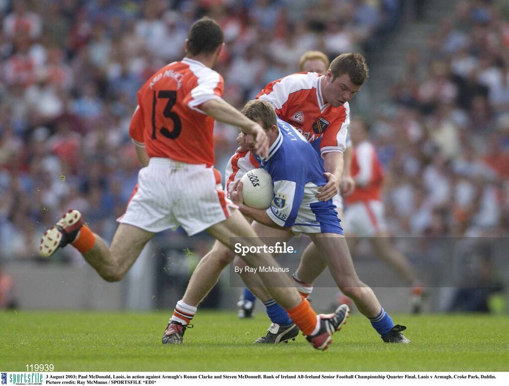 3 August 2003; Paul McDonald of Laois in action against Ronan Clarke and Steven McDonnell of Armagh during the Bank of Ireland All-Ireland Senior Football Championship Quarter Final between Laois and Armagh at Croke Park in Dublin. Photo by Ray McManus/Sportsfile