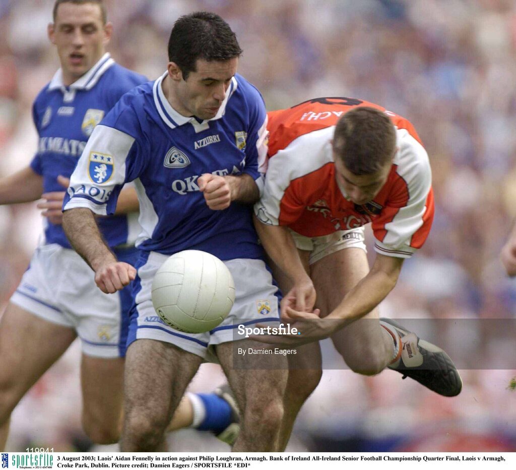 3 August 2003; Aidan Fennelly of Laois in action against Philip Loughran of Armagh during the Bank of Ireland All-Ireland Senior Football Championship Quarter Final between Laois and Armagh at Croke Park in Dublin. Photo by Damien Eagers/Sportsfile