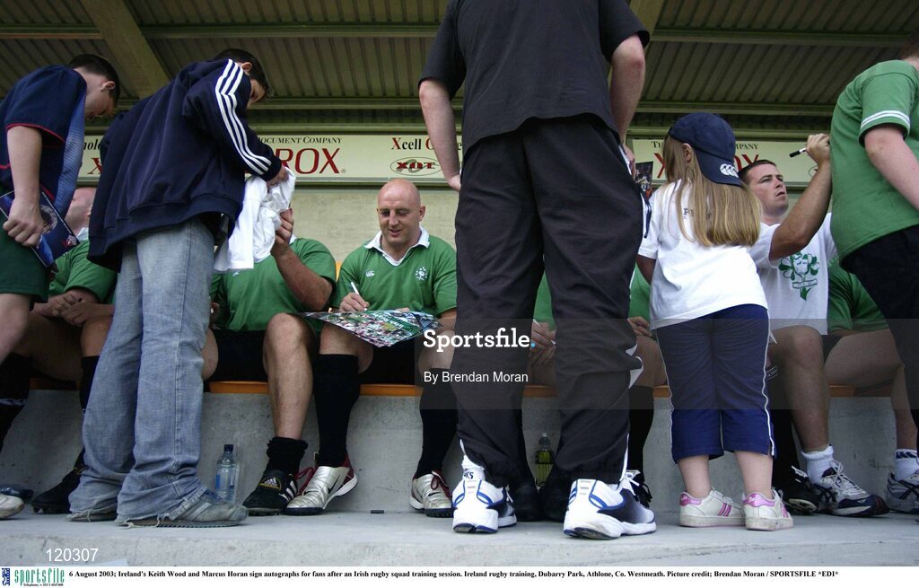 6 August 2003; Keith Wood and Marcus Horan sign autographs for fans after during an Irish rugby squad training session at Dubarry Park, Athlone, Co. Westmeath. Photo by Brendan Moran/Sportsfile