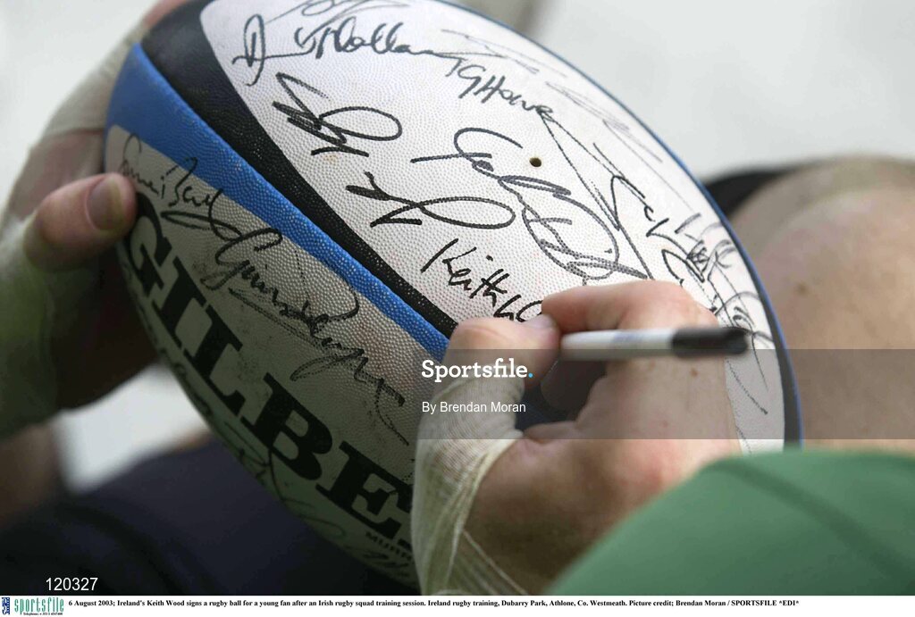 6 August 2003; Keith Wood signs a rugby ball for a young fan after an Irish rugby squad training session at Dubarry Park, Athlone, Co. Westmeath.