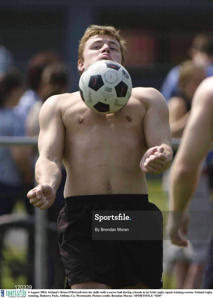6 August 2003; Brian O'Driscoll tests his skills with a soccer ball during an Irish rugby squad training session at Dubarry Park, Athlone, Co. Westmeath. Photo by Brendan Moran/Sportsfile