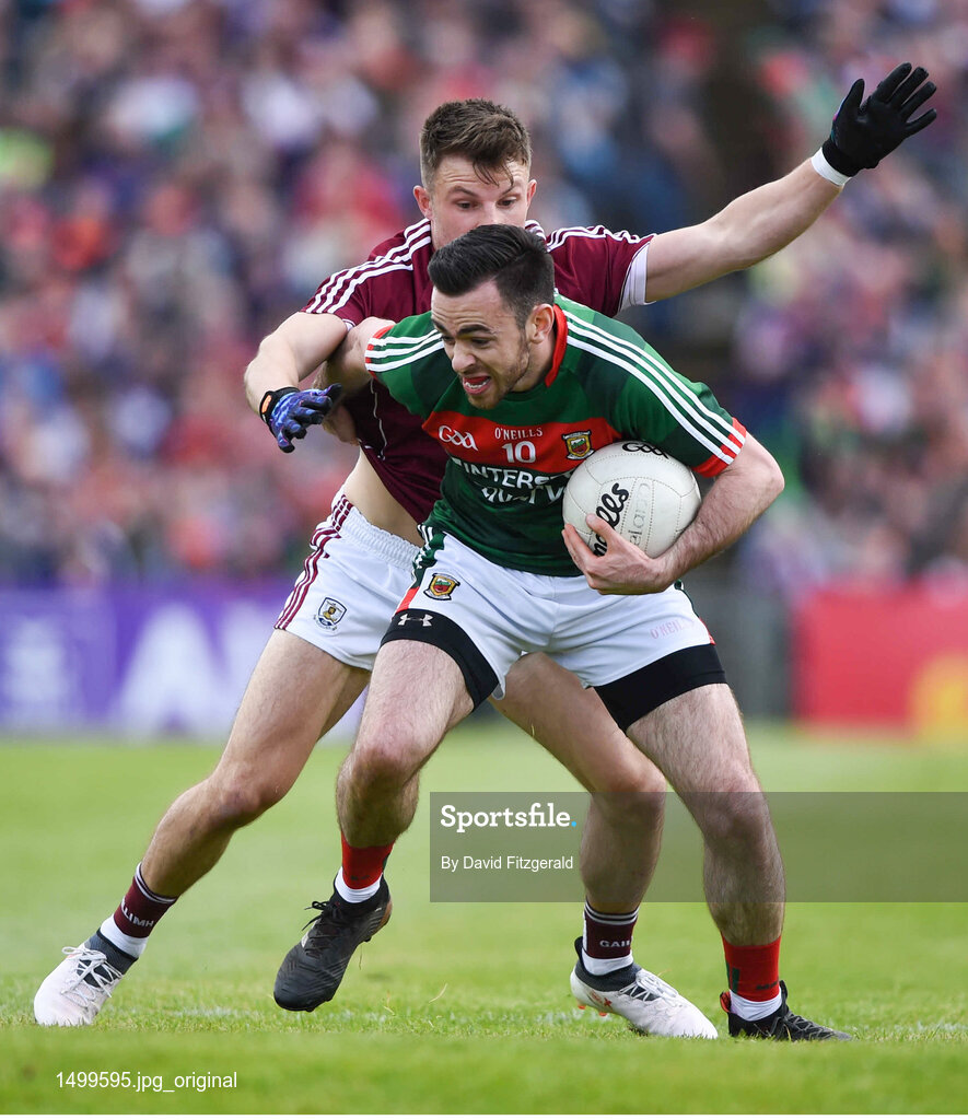 13 May 2018; Kevin McLoughlin of Mayo in action against Damien Comer of Galway during the Connacht GAA Football Senior Championship Quarter-Final match between Mayo and Galway at Elvery's MacHale Park in Mayo. Photo by David Fitzgerald/Sportsfile