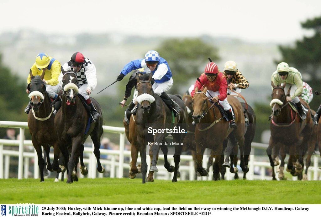29 July 2003; Huxley, with Mick Kinane up, blue and white cap, lead the field on their way to winning the McDonogh D.I.Y. Handicap. Galway Racing Festival, Ballybrit, Galway. Picture credit; Brendan Moran / SPORTSFILE *EDI*