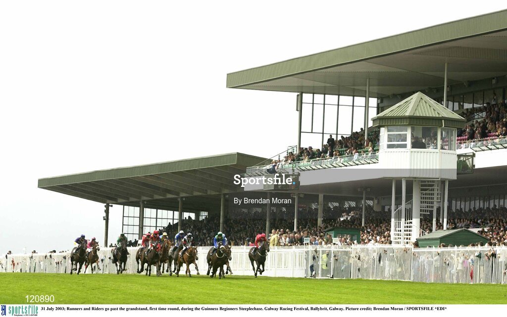 31 July 2003; Runners and Riders go past the grandstand, first time round, during the Guinness Beginners Steeplechase. Galway Racing Festival, Ballybrit, Galway. Picture credit; Brendan Moran / SPORTSFILE *EDI*
