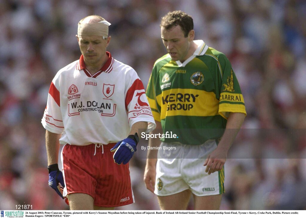 24 August 2003; Peter Canavan of Tyrone, pictured Seamus Moynihan of Kerry before being taken off injured during the Bank of Ireland All-Ireland Senior Football Championship Semi-Final between Tyrone and Kerry at Croke Park, Dublin. Photo by Damien Eagers/Sportsfile