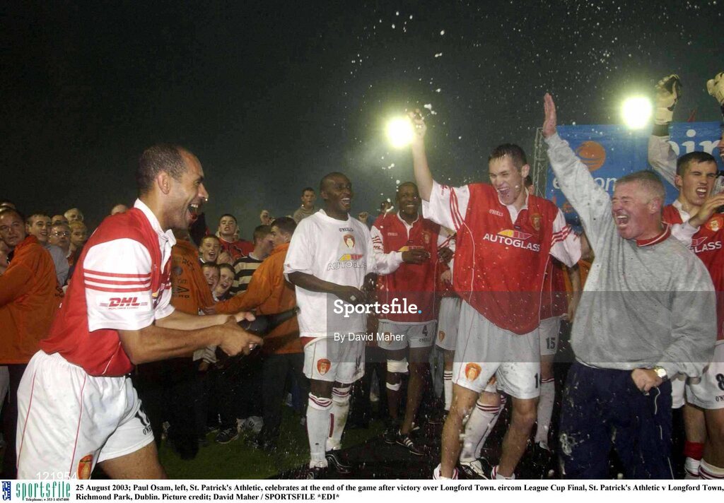 25 August 2003; Paul Osam, left, of St. Patrick's Athletic, celebrates at the end of the game with teammates and manager Eamonn Collins, after victory over Longford Town in the Eircom League Cup Final between St. Patrick's Athletic and Longford Town at Richmond Park, Dublin. Photo by David Maher/Sportsfile