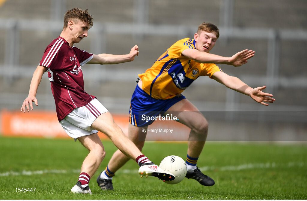 29 July 2018; Matthew Cooley of Galway shoots to score a point under pressure from Jack Reidy of Clare during the Electric Ireland GAA Football All-Ireland Minor Championship Quarter-Final between Galway and Clare at Bord Na Mona O'Connor Park in Tullamore, Co Offaly. Photo by Harry Murphy/Sportsfile