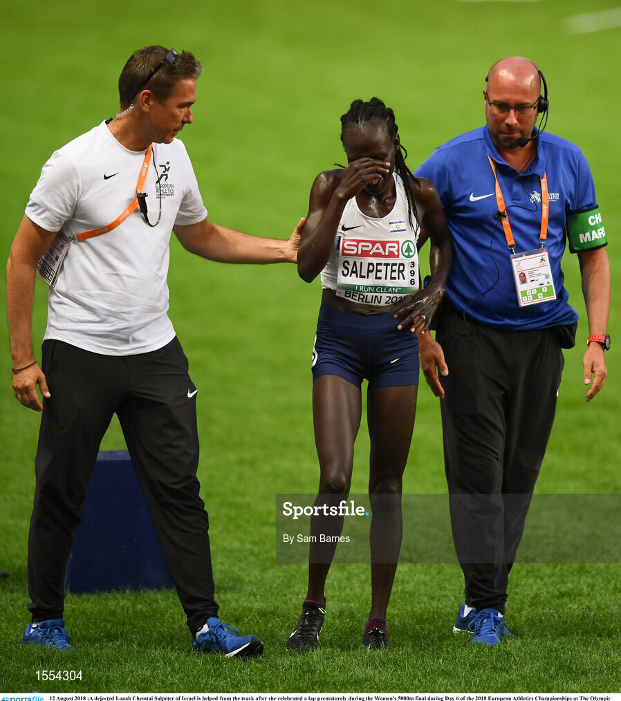 12 August 2018 ;A dejected Lonah Chemtai Salpeter of Israel is helped from the track after she celebrated a lap prematurely during the Women's 5000m final during Day 6 of the 2018 European Athletics Championships at The Olympic Stadium in Berlin, Germany. Photo by Sam Barnes/Sportsfile