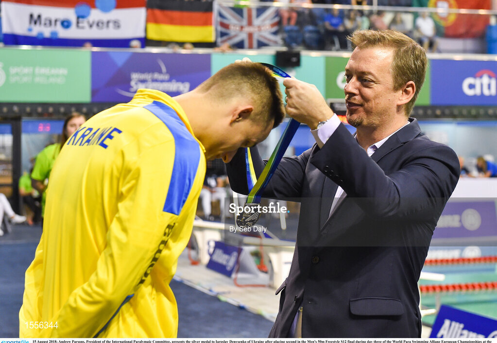 15 August 2018; Andrew Parsons, President of the International Paralympic Committee, presents the silver medal to Iaroslav Denysenko of Ukraine after placing second in the Men's 50m Freestyle S12 final during day three of the World Para Swimming Allianz European Championships at the Sport Ireland National Aquatic Centre in Blanchardstown, Dublin.  Photo by Seb Daly/Sportsfile
