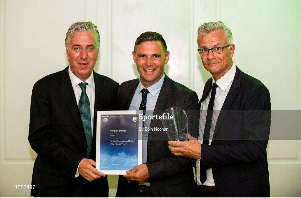 15 August 2018; Adrian Carberry is presented with their certificate by John Delaney, left, CEO, Football Association of Ireland and Ruud Dokter, FAI High Performance Director, during the UEFA Pro Licence Graduation at the Rochestown Park Hotel in Rochestown Rd, Douglas, Co. Cork Photo by Eóin Noonan/Sportsfile