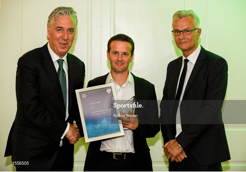 15 August 2018; Colin O'Neill is presented with their certificate by John Delaney, left, CEO, Football Association of Ireland and Ruud Dokter, FAI High Performance Director, during the UEFA Pro Licence Graduation at the Rochestown Park Hotel in Rochestown Rd, Douglas, Co. Cork Photo by Eóin Noonan/Sportsfile