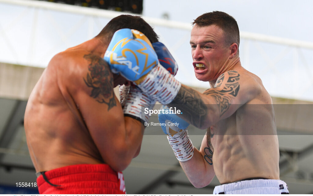18 August 2018; Steven Donnelly, right, in action against Kevin McCauley during their super welterweight bout at Windsor Park in Belfast. Photo by Ramsey Cardy/Sportsfile