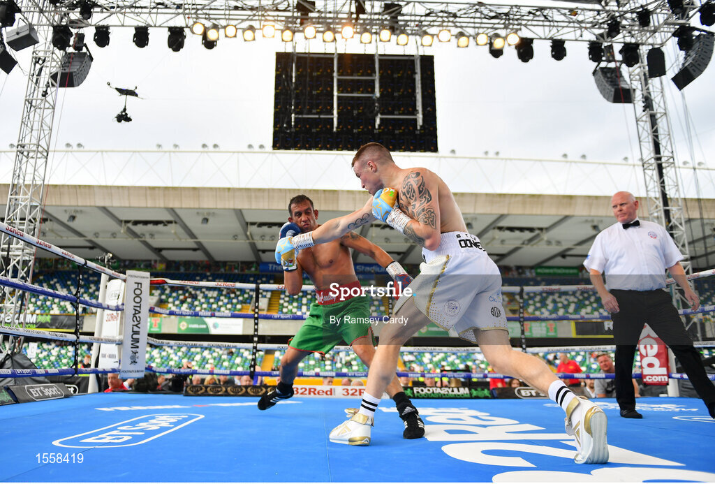 18 August 2018; Steven Donnelly, right, in action against Kevin McCauley during their super welterweight bout at Windsor Park in Belfast. Photo by Ramsey Cardy/Sportsfile