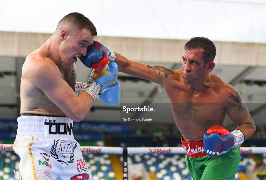 18 August 2018; Steven Donnelly, left, in action against Kevin McCauley during their super welterweight bout at Windsor Park in Belfast. Photo by Ramsey Cardy/Sportsfile