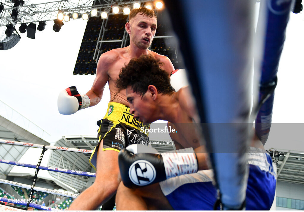 18 August 2018; Sean McComb, left, in action against Reynaldo Mora during their lightweight bout at Windsor Park in Belfast. Photo by Ramsey Cardy/Sportsfile