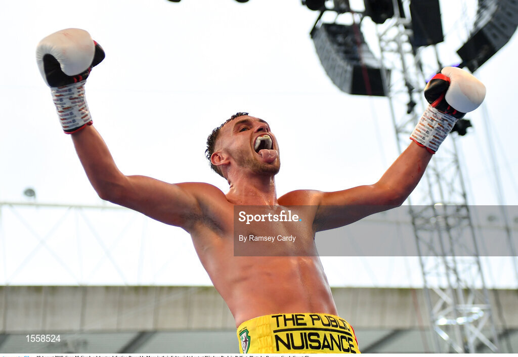 18 August 2018; Sean McComb celebrates defeating Reynaldo Mora in their lightweight bout at Windsor Park in Belfast. Photo by Ramsey Cardy/Sportsfile