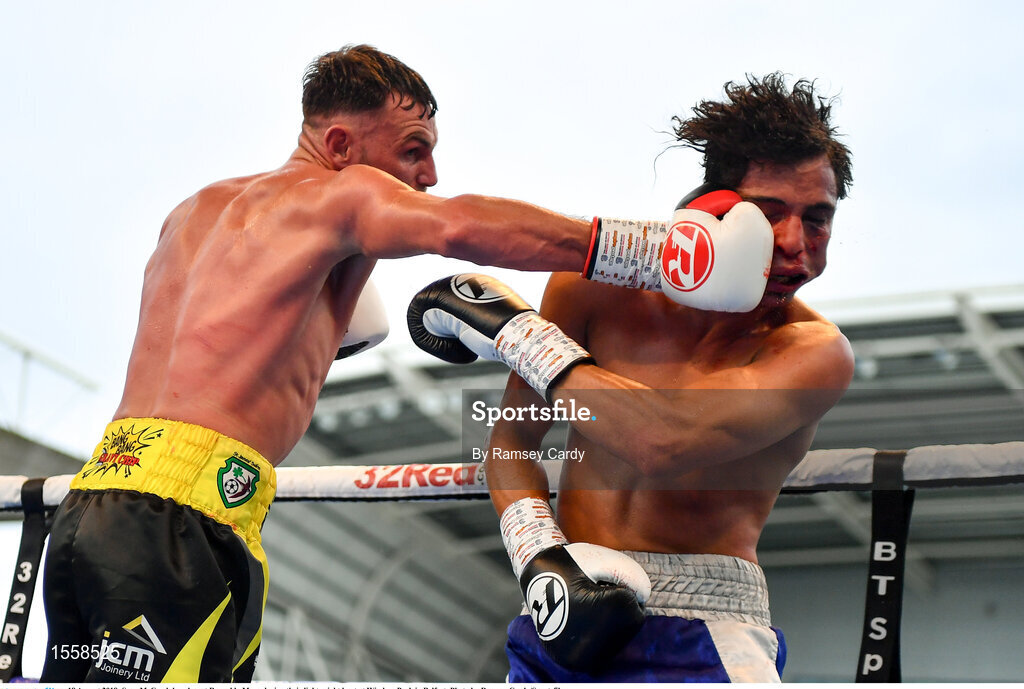 18 August 2018; Sean McComb knocks out Reynaldo Mora during their lightweight bout at Windsor Park in Belfast. Photo by Ramsey Cardy/Sportsfile