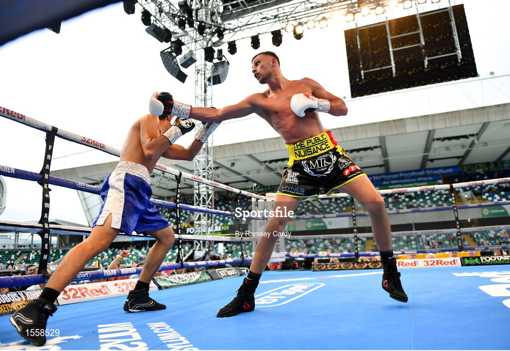 18 August 2018; Sean McComb, right, in action against Reynaldo Mora during their lightweight bout at Windsor Park in Belfast. Photo by Ramsey Cardy/Sportsfile