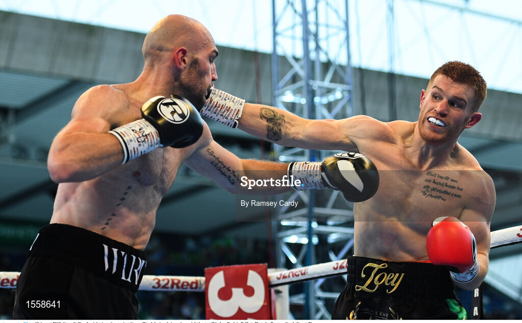 18 August 2018; Steve Collins Jr, right, in action against Steven Ward during their cruiserweight bout at Windsor Park in Belfast. Photo by Ramsey Cardy/Sportsfile