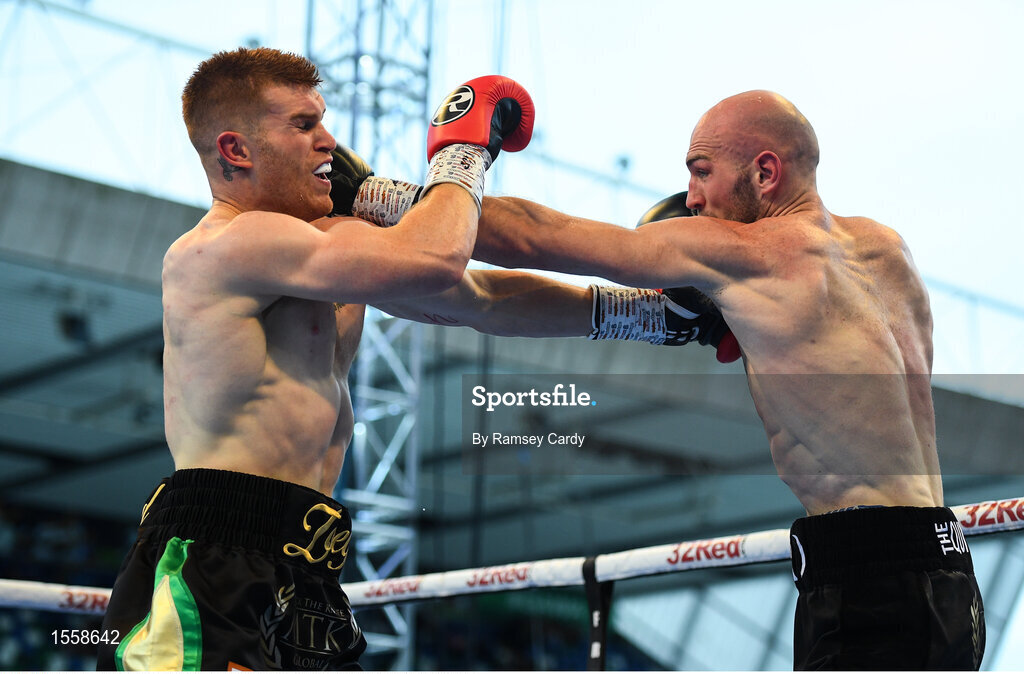18 August 2018; Steve Collins Jr, left, in action against Steven Ward during their cruiserweight bout at Windsor Park in Belfast. Photo by Ramsey Cardy/Sportsfile