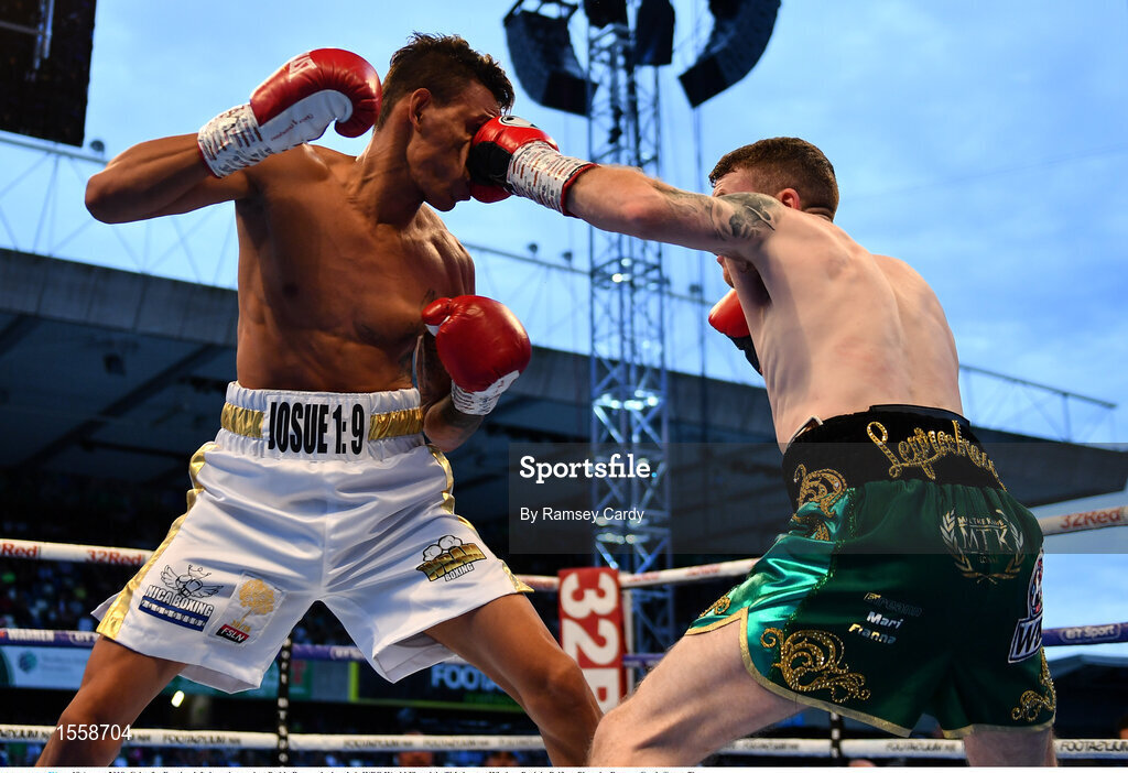 18 August 2018; Cristofer Rosales, left, in action against Paddy Barnes during their WBO World Flyweight Title bout at Windsor Park in Belfast. Photo by Ramsey Cardy/Sportsfile