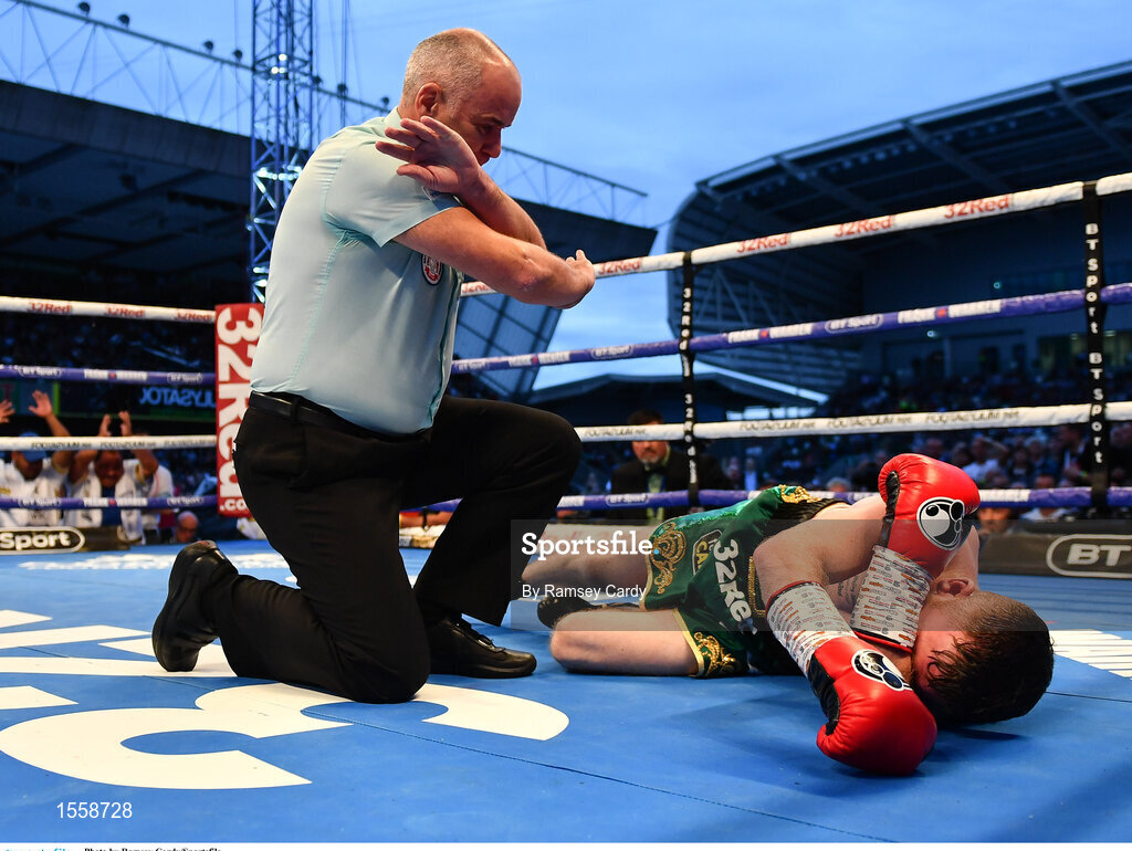 18 August 2018; Paddy Barnes is counted out by the Referee during his WBO World Flyweight Title bout against Cristofer Rosales at Windsor Park in Belfast. Photo by Ramsey Cardy/Sportsfile
