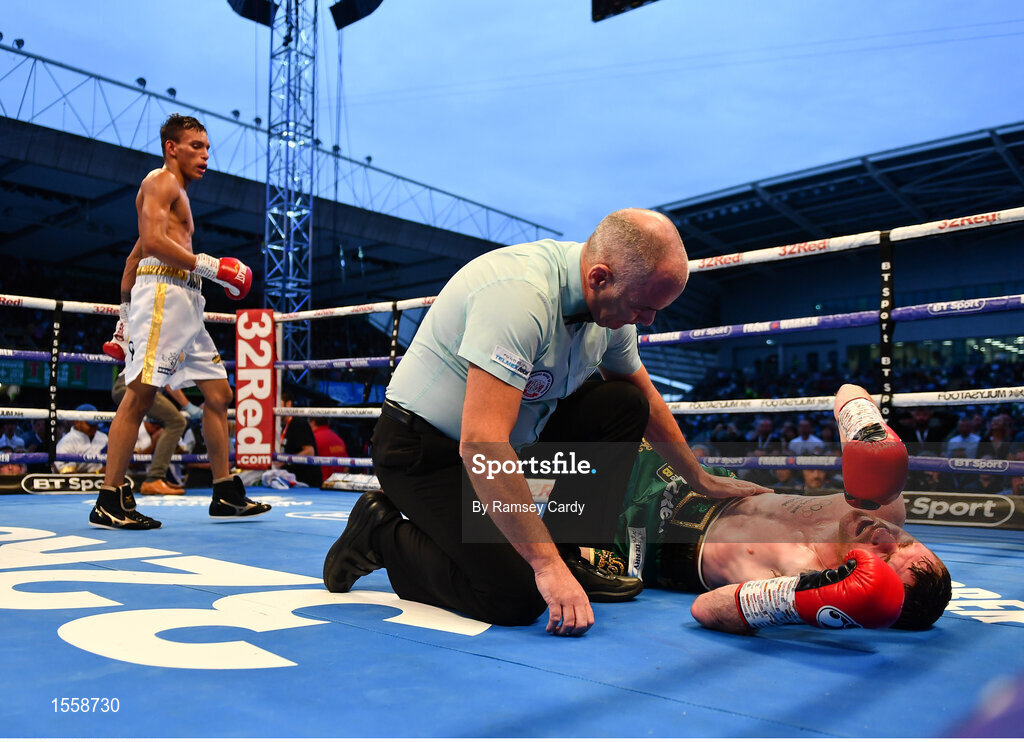 18 August 2018; Paddy Barnes is counted out by the Referee during his WBO World Flyweight Title bout against Cristofer Rosales at Windsor Park in Belfast. Photo by Ramsey Cardy/Sportsfile