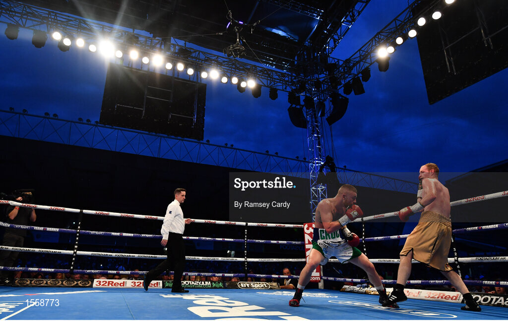 18 August 2018; Lewis Crocker, left, in action against William Warburton during their welterweight bout at Windsor Park in Belfast. Photo by Ramsey Cardy/Sportsfile