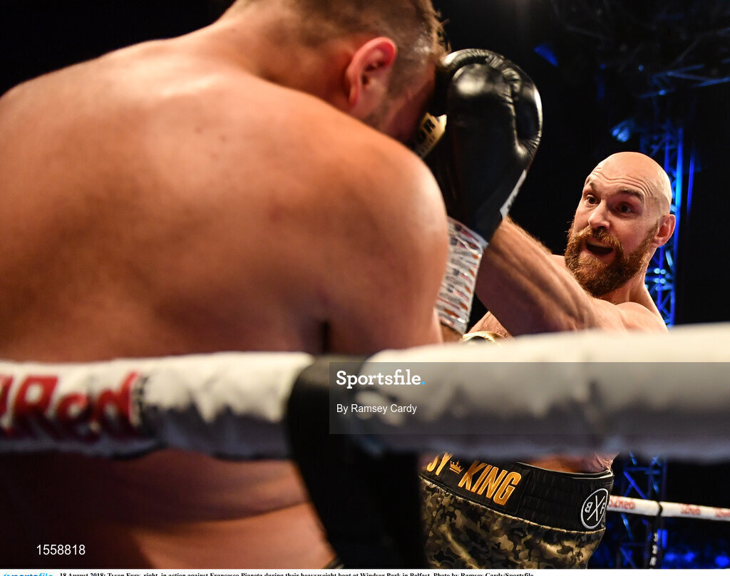 18 August 2018; Tyson Fury, right, in action against Francesco Pianeta during their heavyweight bout at Windsor Park in Belfast. Photo by Ramsey Cardy/Sportsfile