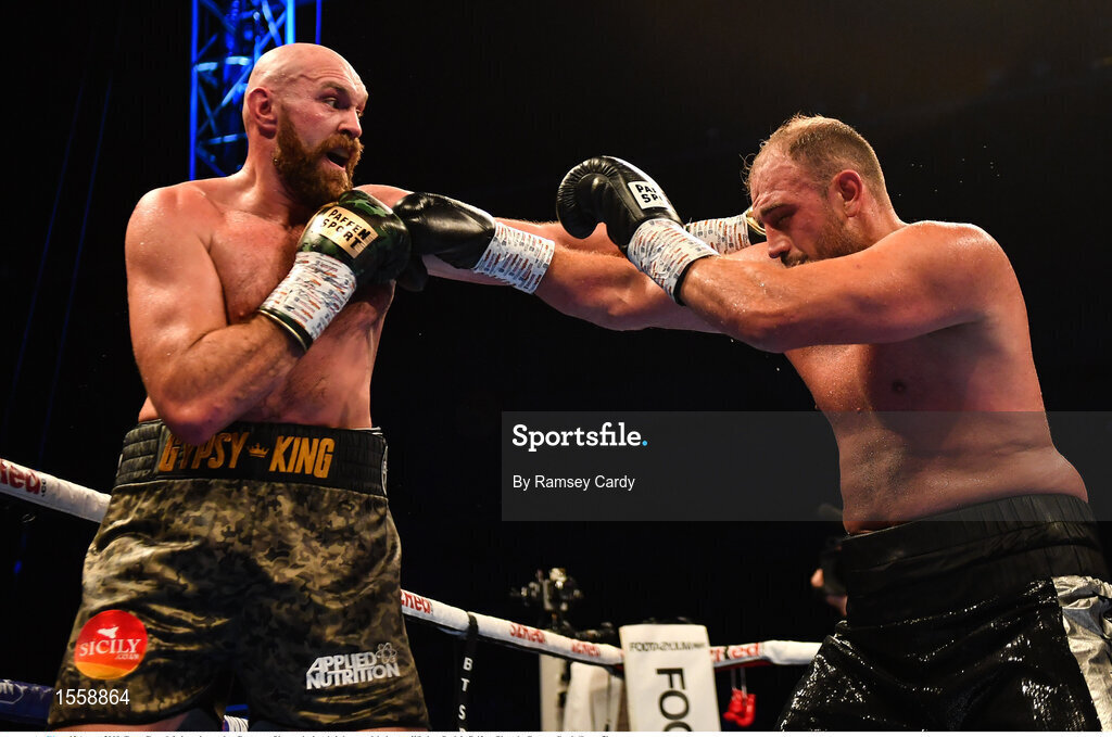 18 August 2018; Tyson Fury, left, in action against Francesco Pianeta during their heavyweight bout at Windsor Park in Belfast. Photo by Ramsey Cardy/Sportsfile