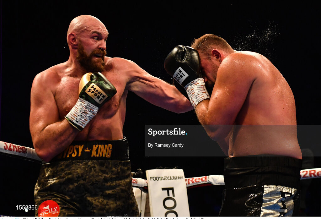 18 August 2018; Tyson Fury, left, in action against Francesco Pianeta during their heavyweight bout at Windsor Park in Belfast. Photo by Ramsey Cardy/Sportsfile