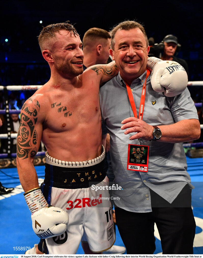 18 August 2018; Carl Frampton celebrates his victory against Luke Jackson with father Craig following their interim World Boxing Organisation World Featherweight Title bout at Windsor Park in Belfast. Photo by Ramsey Cardy/Sportsfile