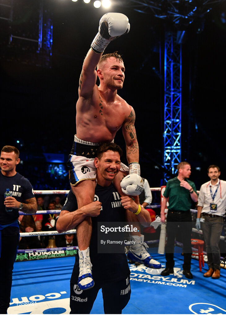 18 August 2018; Carl Frampton celebrates his victory against Luke Jackson with coach Nigel Travis following their interim World Boxing Organisation World Featherweight Title bout at Windsor Park in Belfast. Photo by Ramsey Cardy/Sportsfile
