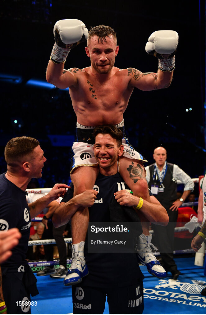 18 August 2018; Carl Frampton celebrates his victory against Luke Jackson with coach Nigel Travis following their interim World Boxing Organisation World Featherweight Title bout at Windsor Park in Belfast. Photo by Ramsey Cardy/Sportsfile
