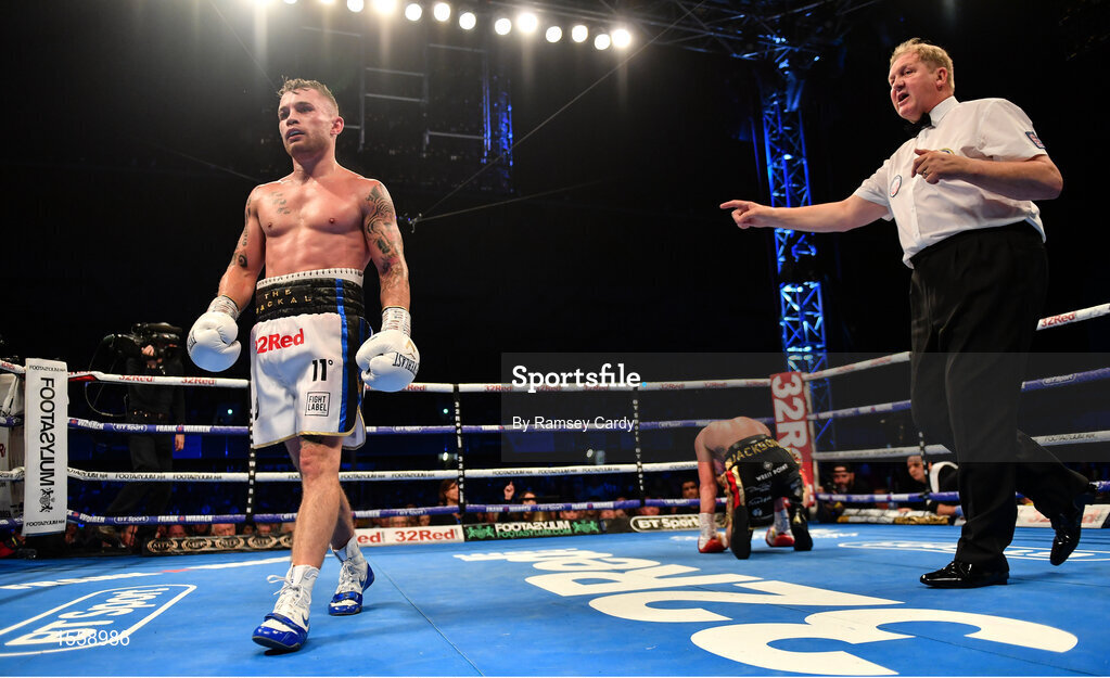 18 August 2018; Carl Frampton, left, after knocking down Luke Jackson in the 8th round of their interim World Boxing Organisation World Featherweight Title bout at Windsor Park in Belfast. Photo by Ramsey Cardy/Sportsfile