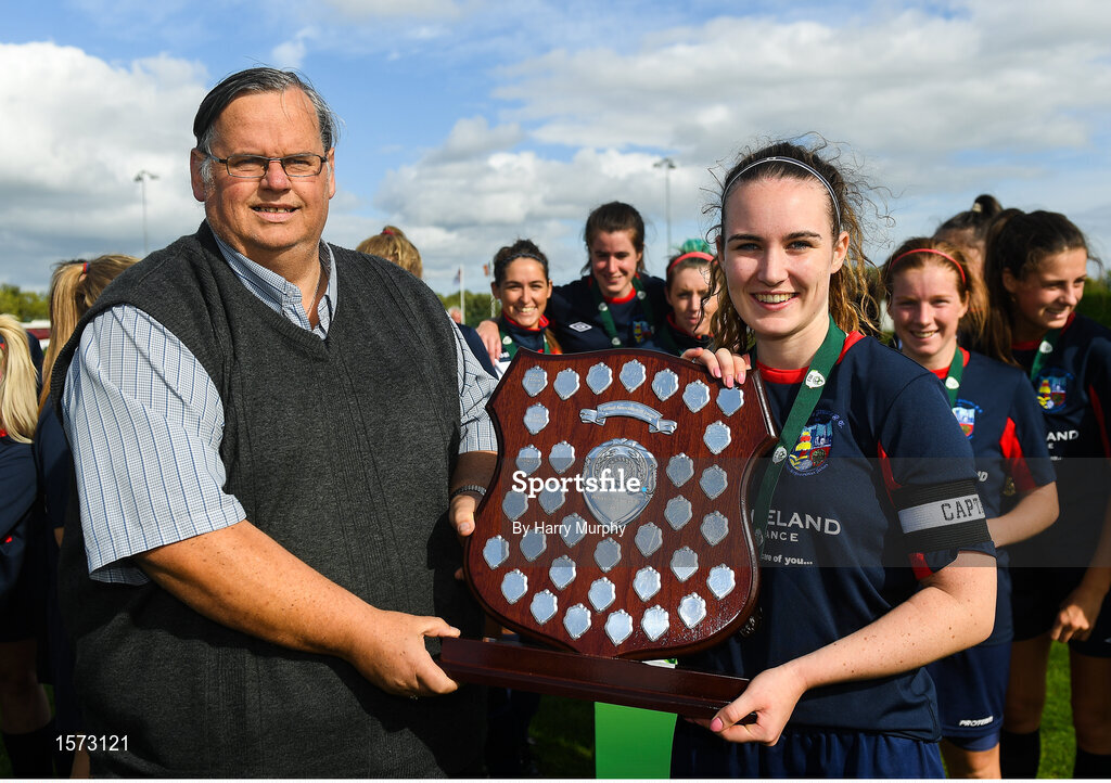 9 September 2018; Ali Brady of Lakewood Athletic is presented the shield by Womens Football Committee member Padraig Hartnett after the FAI Women’s Intermediate Shield Final match between TEK United and Lakewood Athletic at Newhill Park in Two Mile Borris, Tipperary.  Photo by Harry Murphy/Sportsfile