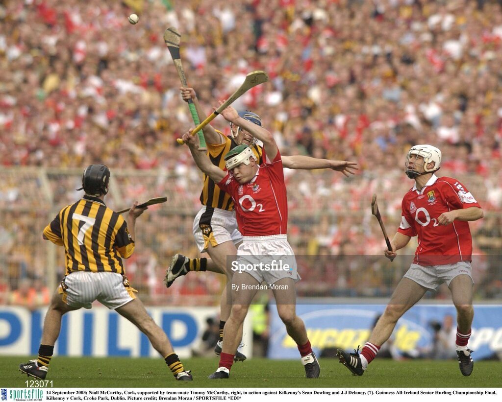14 September 2003; Niall McCarthy, Cork, supported by team-mate Timmy McCarthy, right, in action against Kilkenny's Sean Dowling and J.J Delaney, (7). Guinness All-Ireland Senior Hurling Championship Final, Kilkenny v Cork, Croke Park, Dublin. Picture credit; Brendan Moran / SPORTSFILE *EDI*