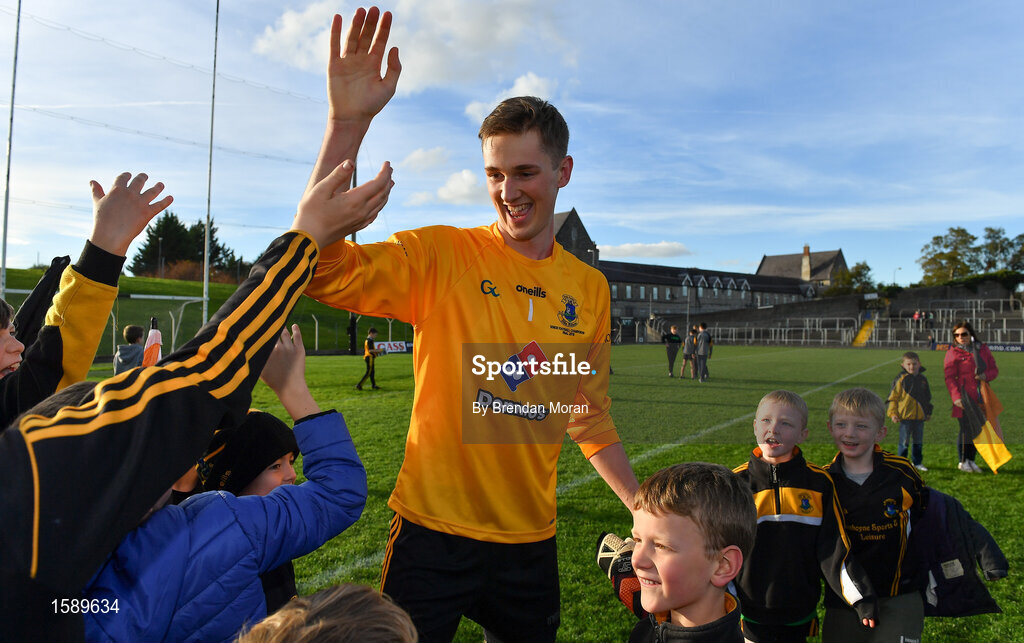 14 October 2018; Cian Flynn of St Peter's Dunboyne celebrates with young fans after during the Meath County Senior Club Football Championship Final match between St Peter's Dunboyne and Summerhill at Páirc Tailteann in Navan, Meath. Photo by Brendan Moran/Sportsfile