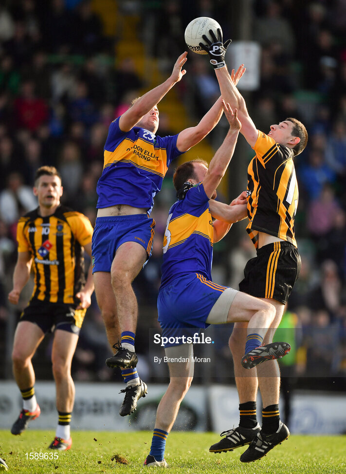 14 October 2018; Robert McCarthy of St Peter's Dunboyne gets to the ball ahead of Ross Ryan, left, and Caolan Young of Summerhill to set up his side's only goal during the Meath County Senior Club Football Championship Final match between St Peter's Dunboyne and Summerhill at Páirc Tailteann in Navan, Meath. Photo by Brendan Moran/Sportsfile