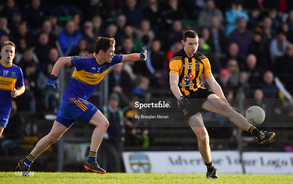 14 October 2018; Robert McCarthy of St Peter's Dunboyne kicks a point despite the best efforts of Willie Ryan of Summerhill during the Meath County Senior Club Football Championship Final match between St Peter's Dunboyne and Summerhill at Páirc Tailteann in Navan, Meath. Photo by Brendan Moran/Sportsfile