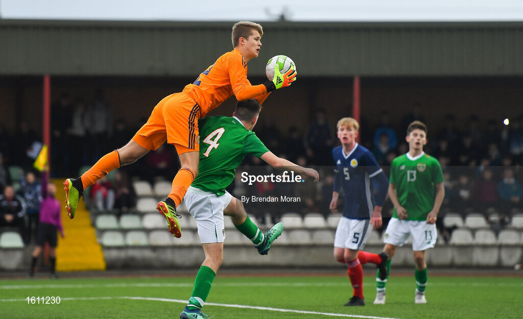 16 November 2018; Scotland goalkeeper Jay Hogarth collects a high ball from Oisin Hand of Republic of Ireland during the U16 Victory Shield match between Republic of Ireland and Scotland at Mounthawk Park in Tralee, Kerry. Photo by Brendan Moran/Sportsfile