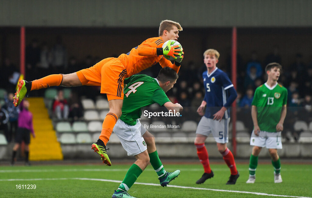 16 November 2018; Scotland goalkeeper Jay Hogarth collects a high ball from Oisin Hand of Republic of Ireland during the U16 Victory Shield match between Republic of Ireland and Scotland at Mounthawk Park in Tralee, Kerry. Photo by Brendan Moran/Sportsfile